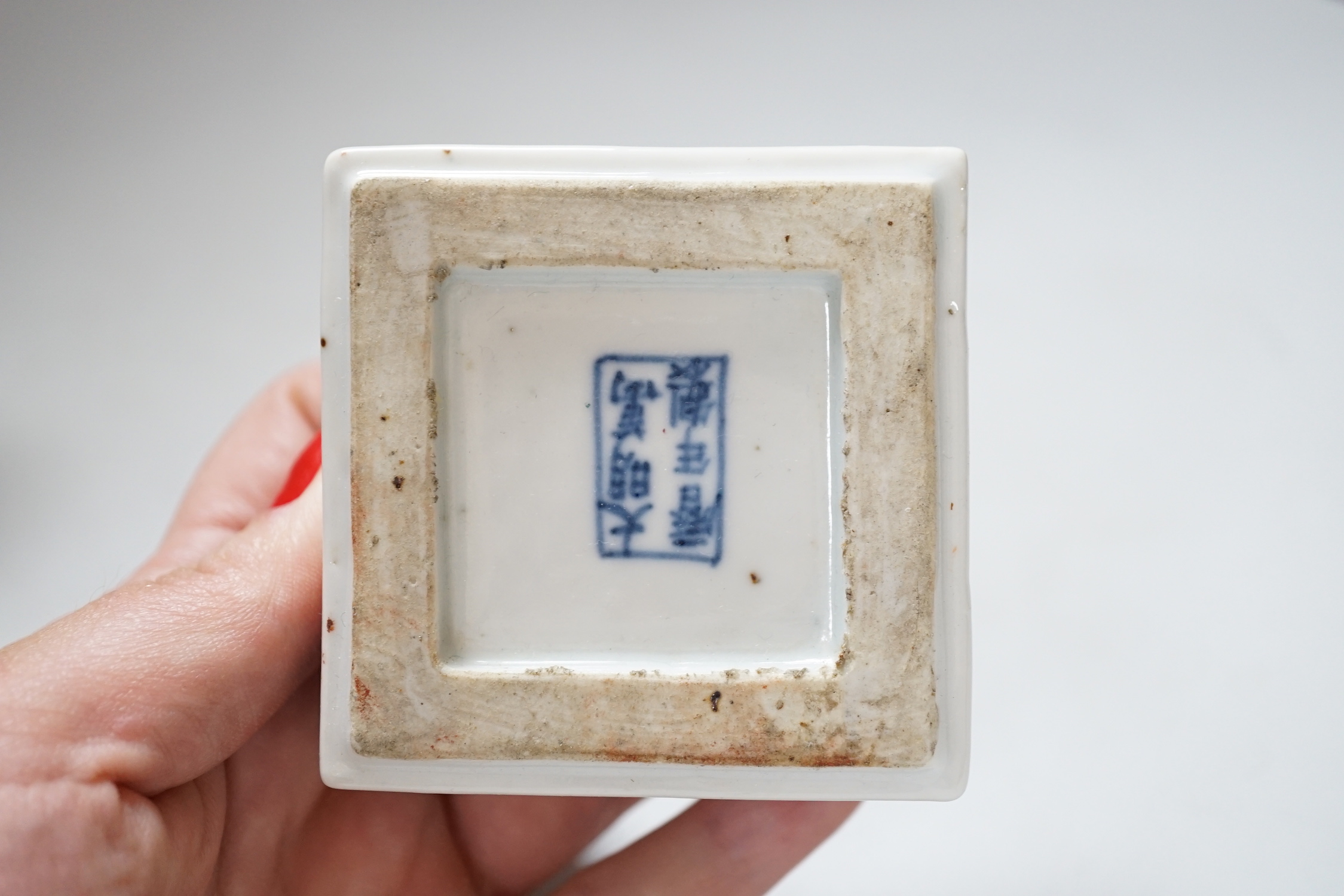 Three Chinese blue and white vases and a wucai square box, one with inscription, 18th century and later, tallest 14cm high